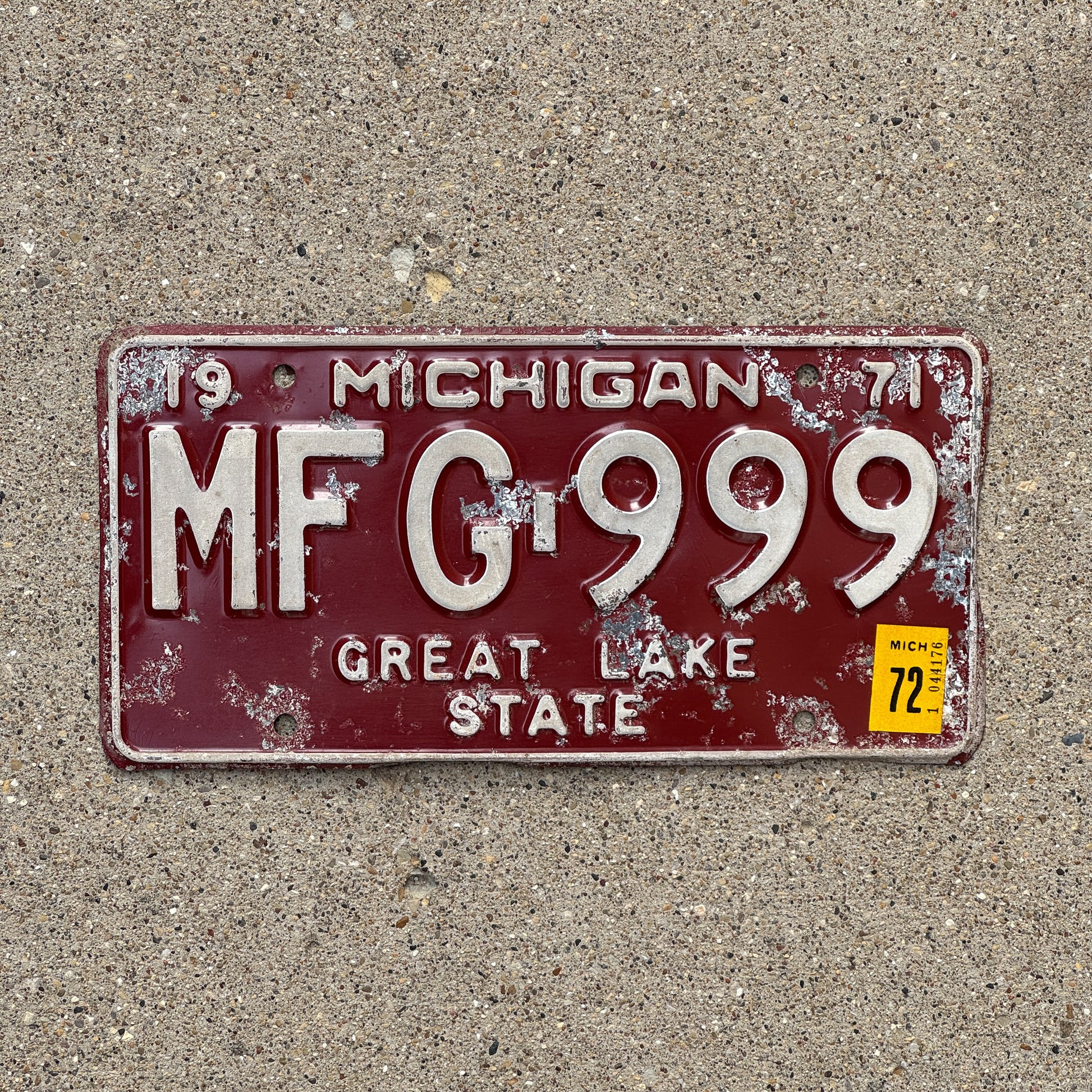 Photo of a 1971 1972 Michigan License Plate Auto Tag 2 Vintage Garage Repeat Repeating MFG 999 with original patina