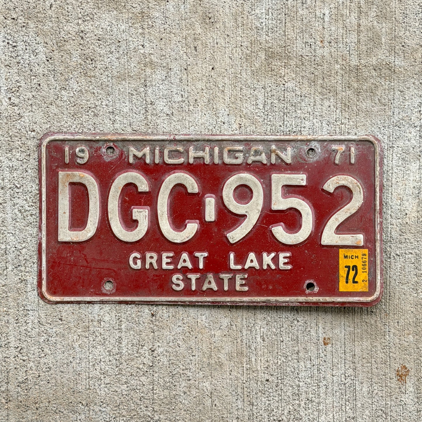 Photo of a 1971 1972 Michigan License Plate Auto Tag Garage Decor Vintage DGC 952 with original patina