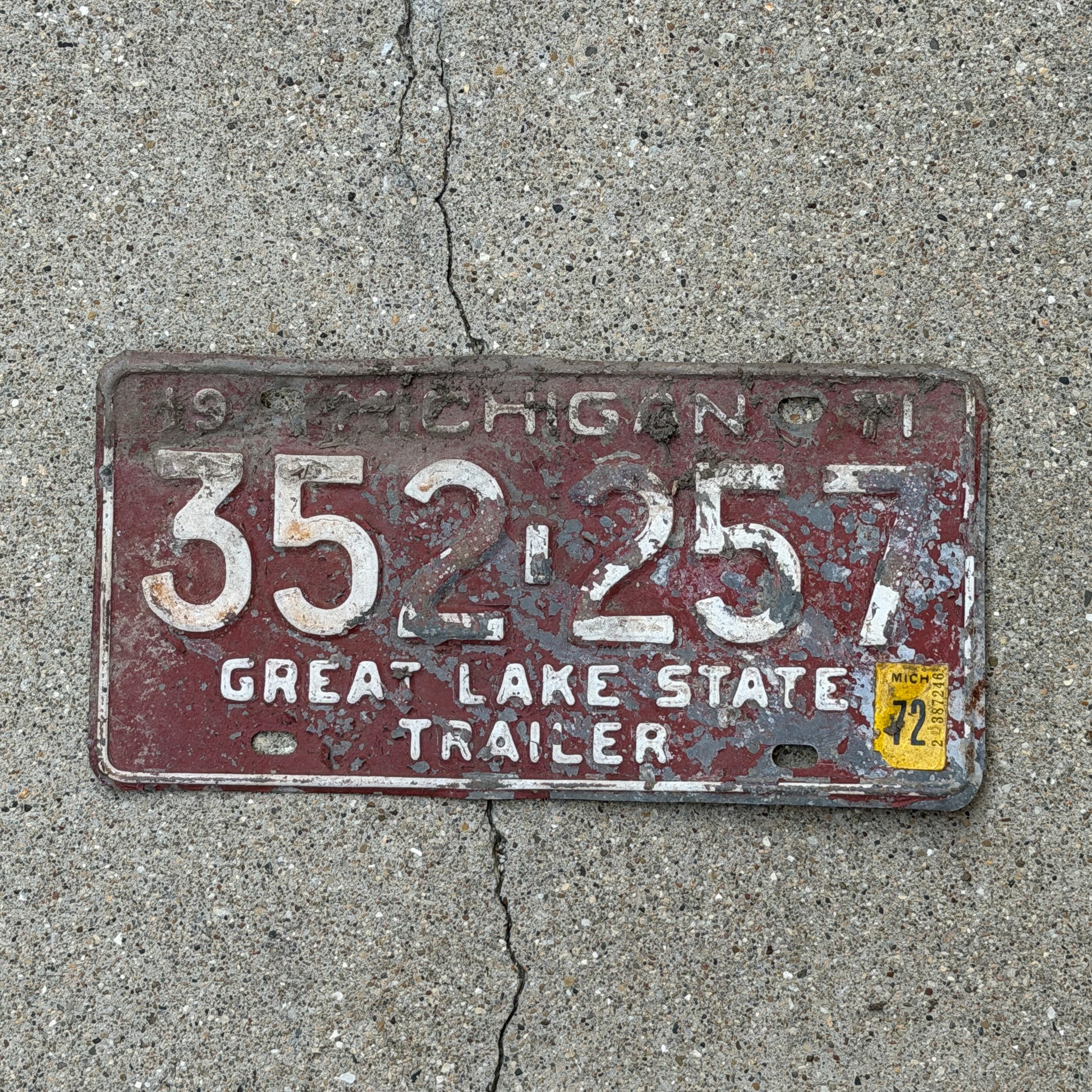 Photo of a 1971 1972 Michigan Trailer License Plate Auto Tag Garage Decor Vintage 352 257 with original patina