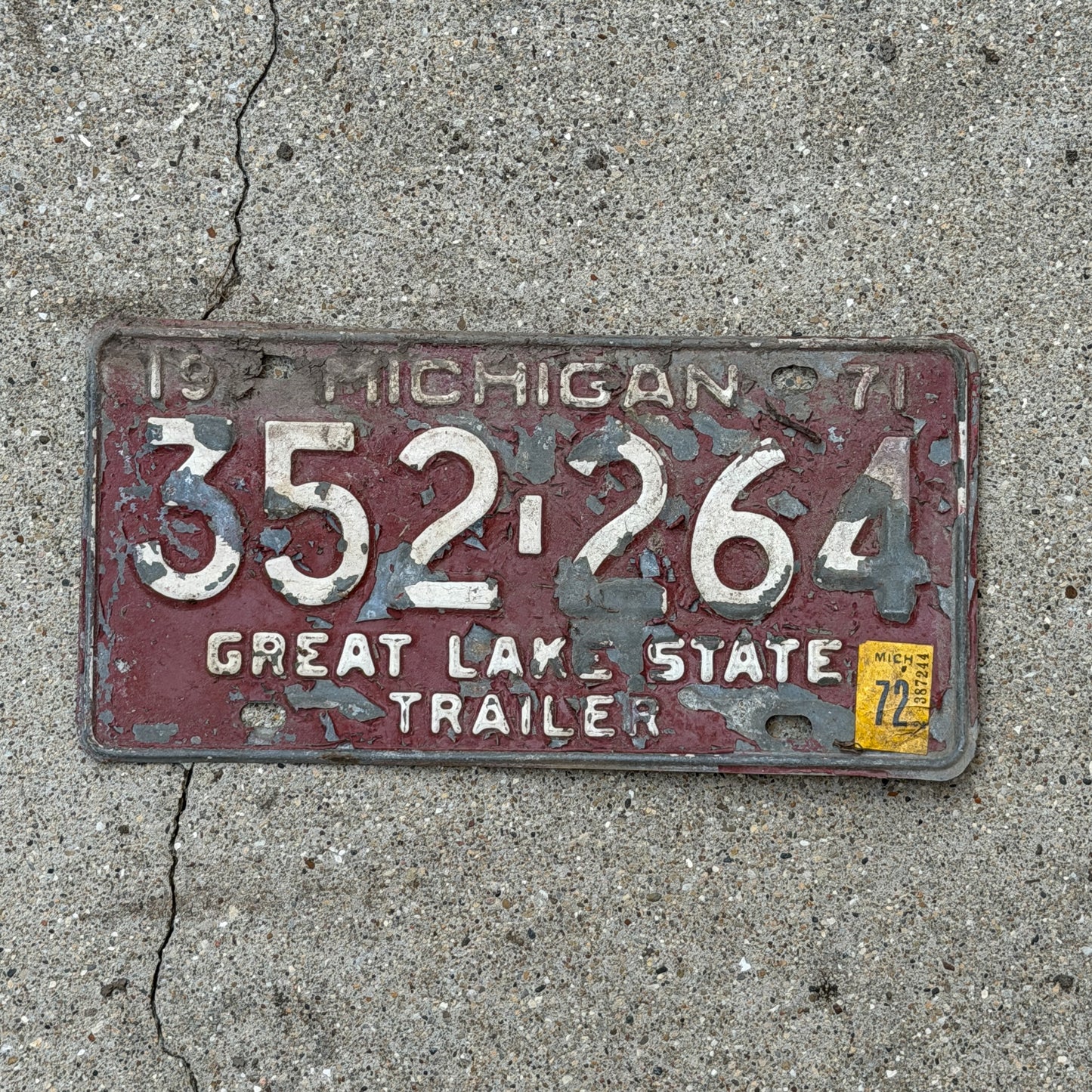 Photo of a 1971 1972 Michigan Trailer License Plate Auto Tag Garage Decor Vintage 352 264 with original patina