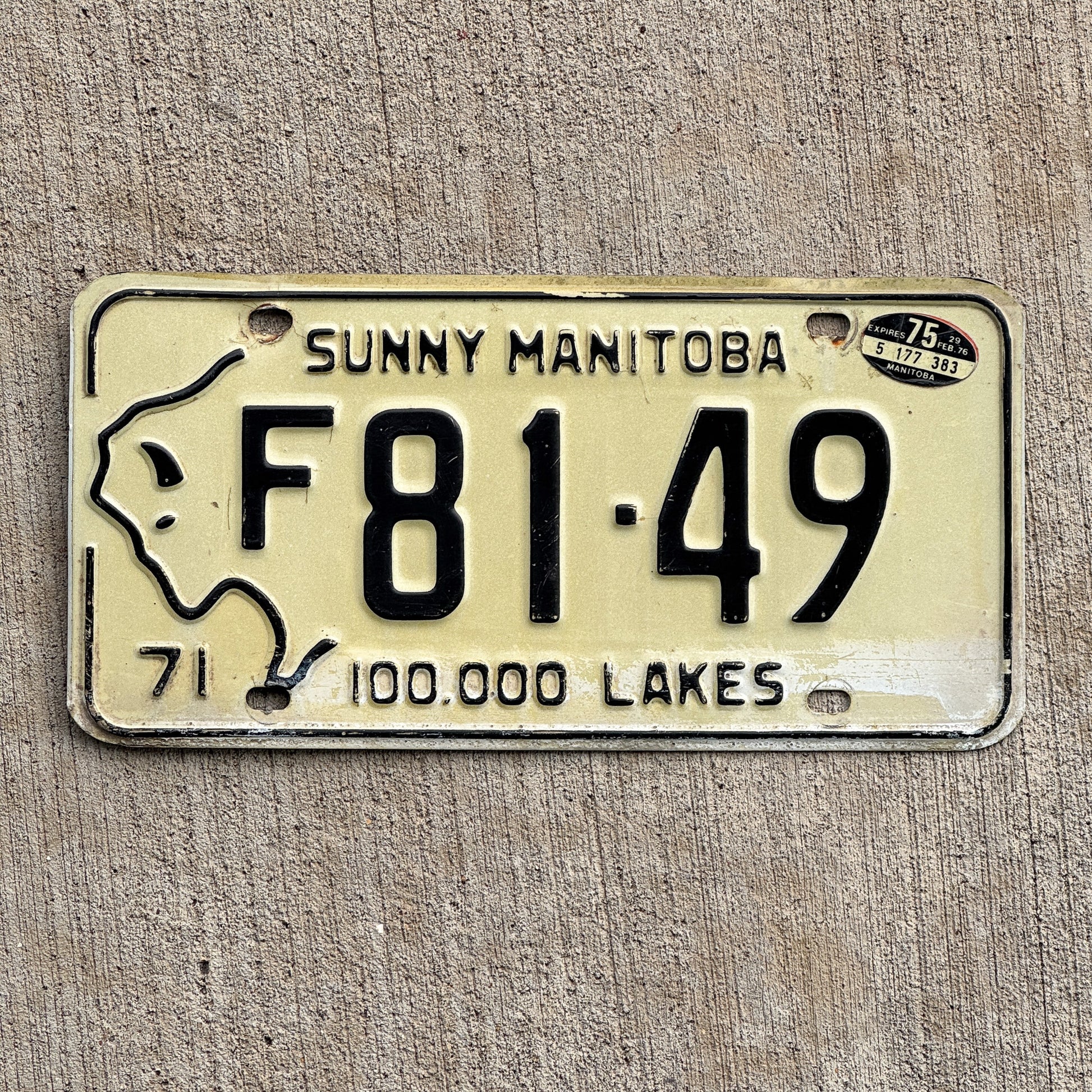 Photo of a 1971 1975 Manitoba Farm Truck License Plate Auto Tag Garage Decor Vintage Bison Graphic F 81 49 with original patina