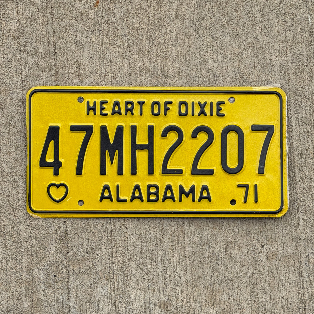 Photo of a 1971 Alabama Mobile Home License Plate Auto Tag Garage Decor Vintage 47 MH 2207 with original patina