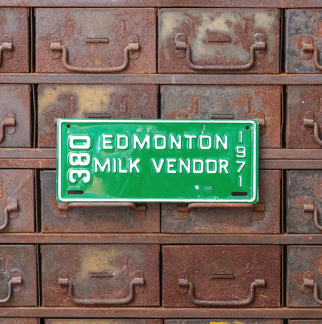 Photo of a 1971 Alberta Milk Vendor License Plate Auto Tag Garage Decor Vintage Edmonton 380 with original patina