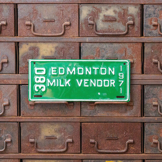 Photo of a 1971 Alberta Milk Vendor License Plate Auto Tag Garage Decor Vintage Edmonton 380 with original patina