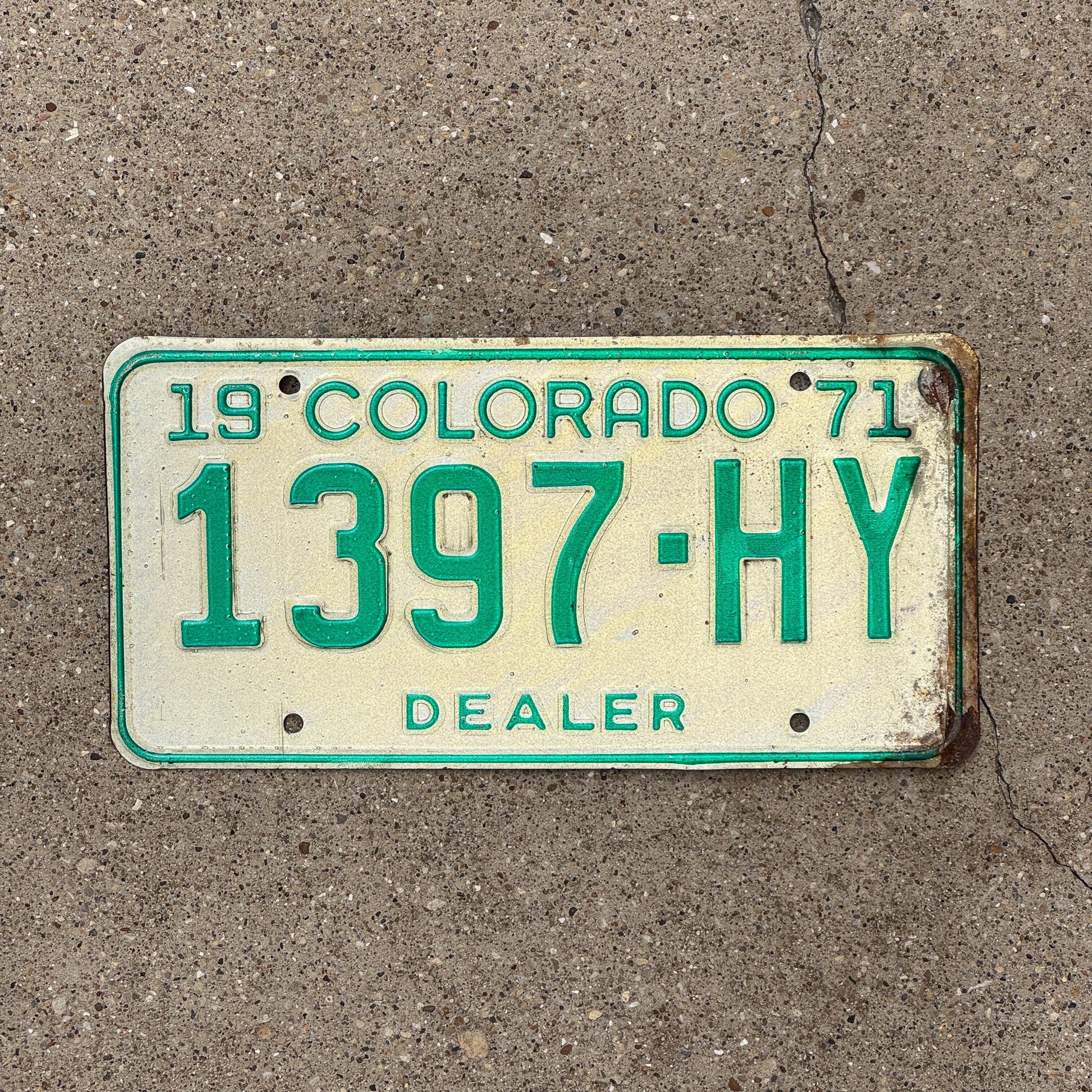 Photo of a 1971 Colorado Dealer License Plate Auto Tag Garage Decor Vintage 1397 HY