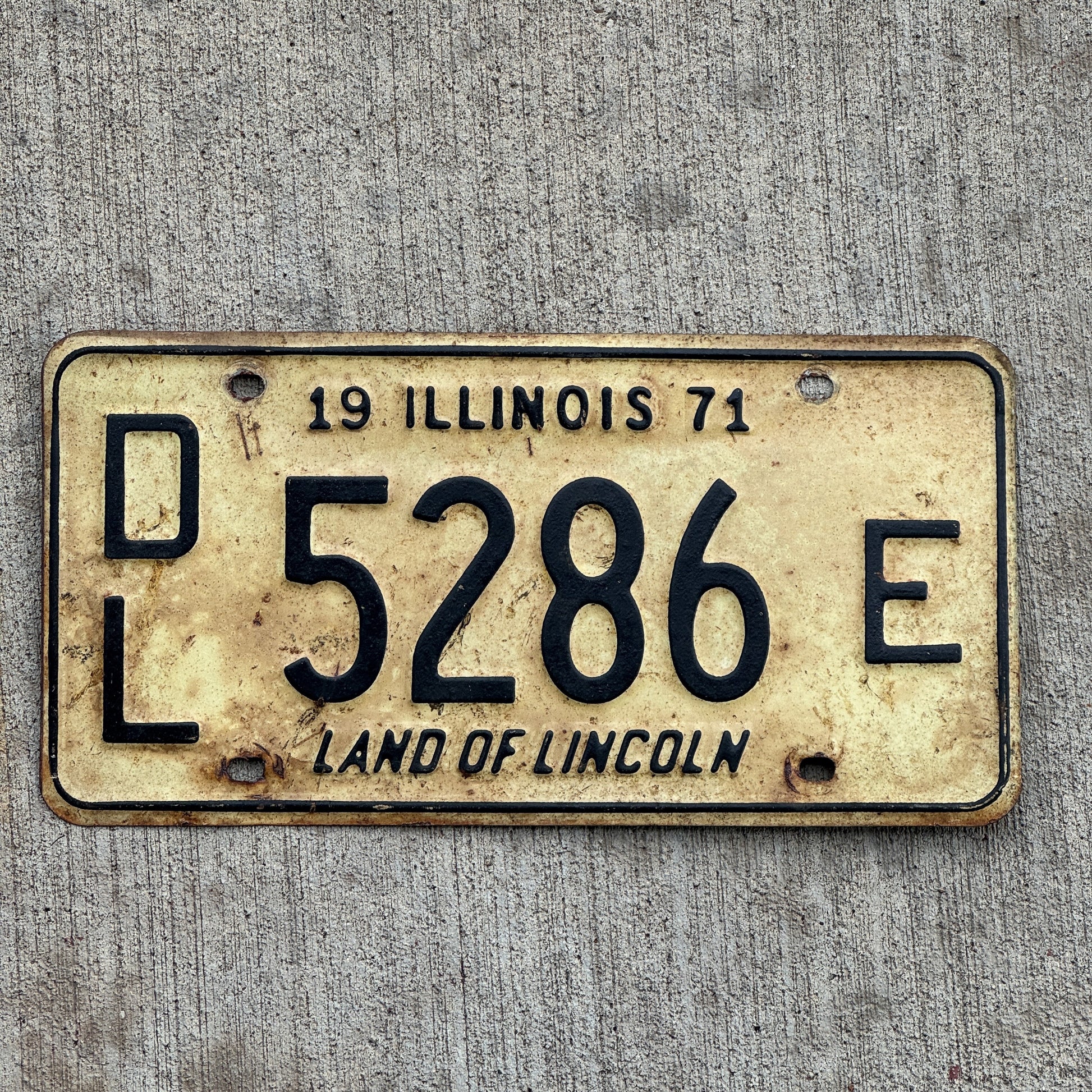 Photo of a 1971 Illinois Dealer License Plate Auto Tag 1 Vintage Garage 5286 E with original patina