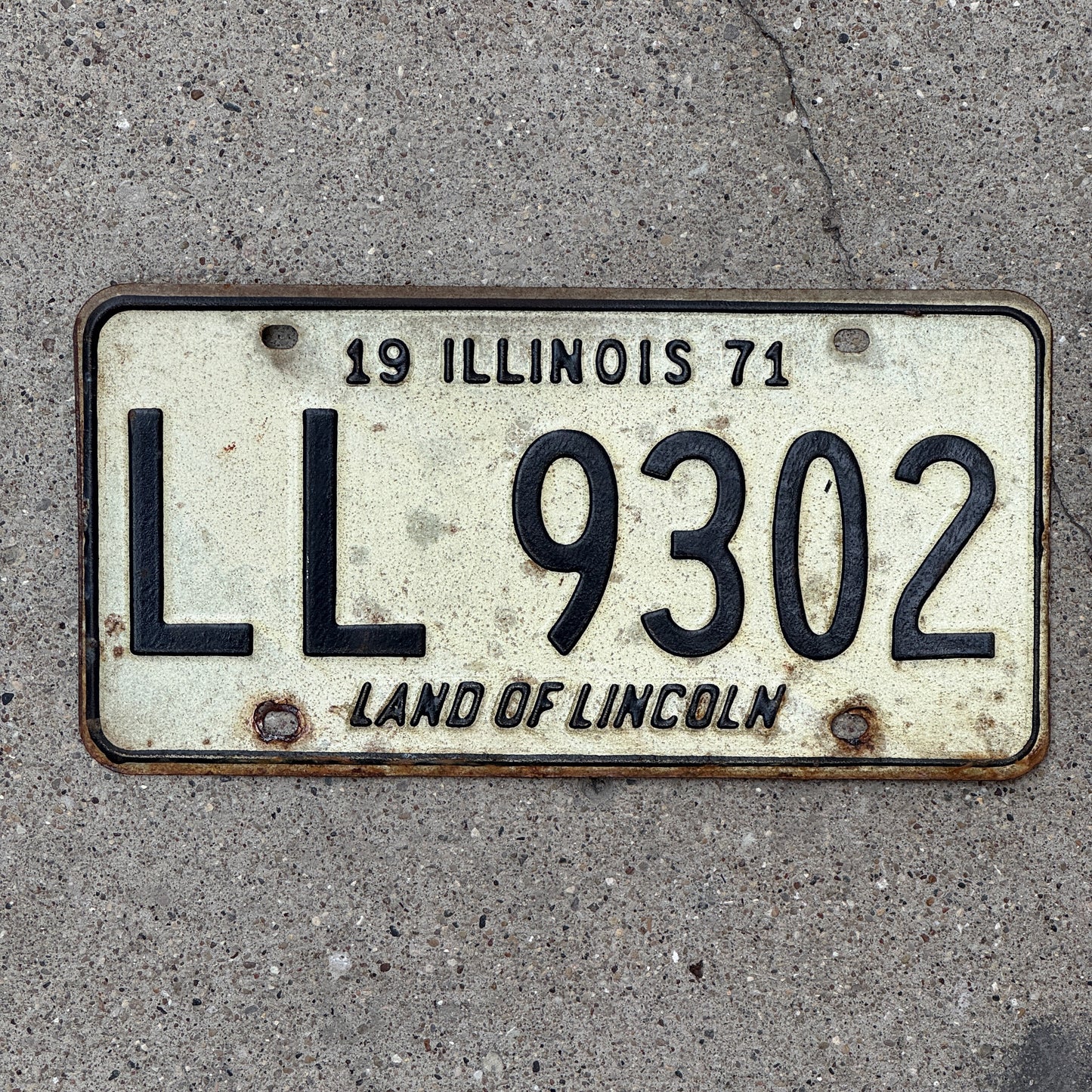 Photo of a 1971 Illinois License Plate Auto Tag 1 Vintage Garage LL 9302 with original patina