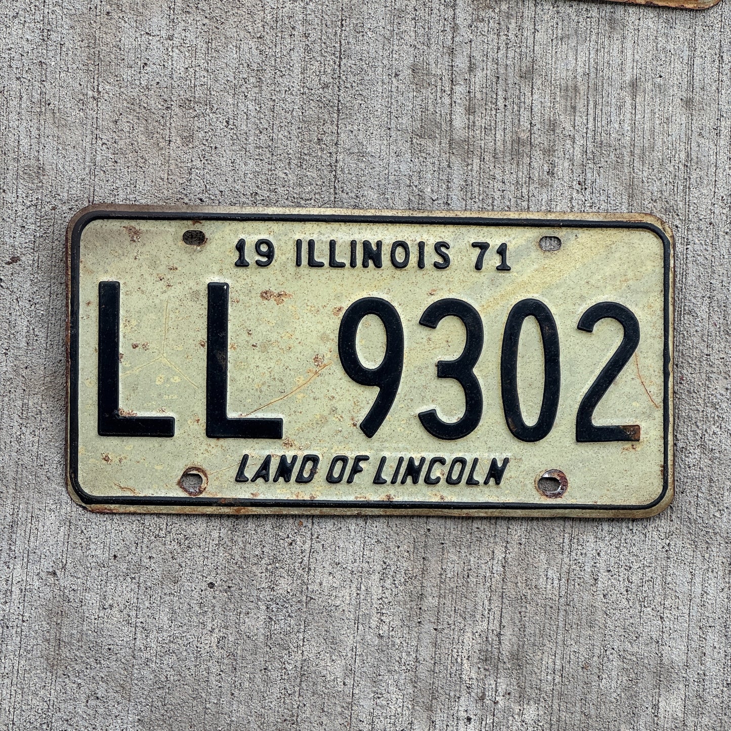 Photo of a 1971 Illinois License Plate Auto Tag 2 Vintage Garage LL 9302 with original patina