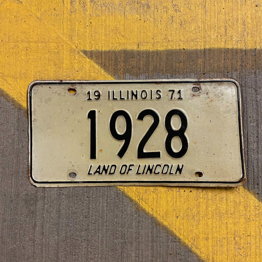 Photo of a 1971 Illinois License Plate Auto Tag Garage Decor Vintage Low Number Four Digit 1928 with original patina