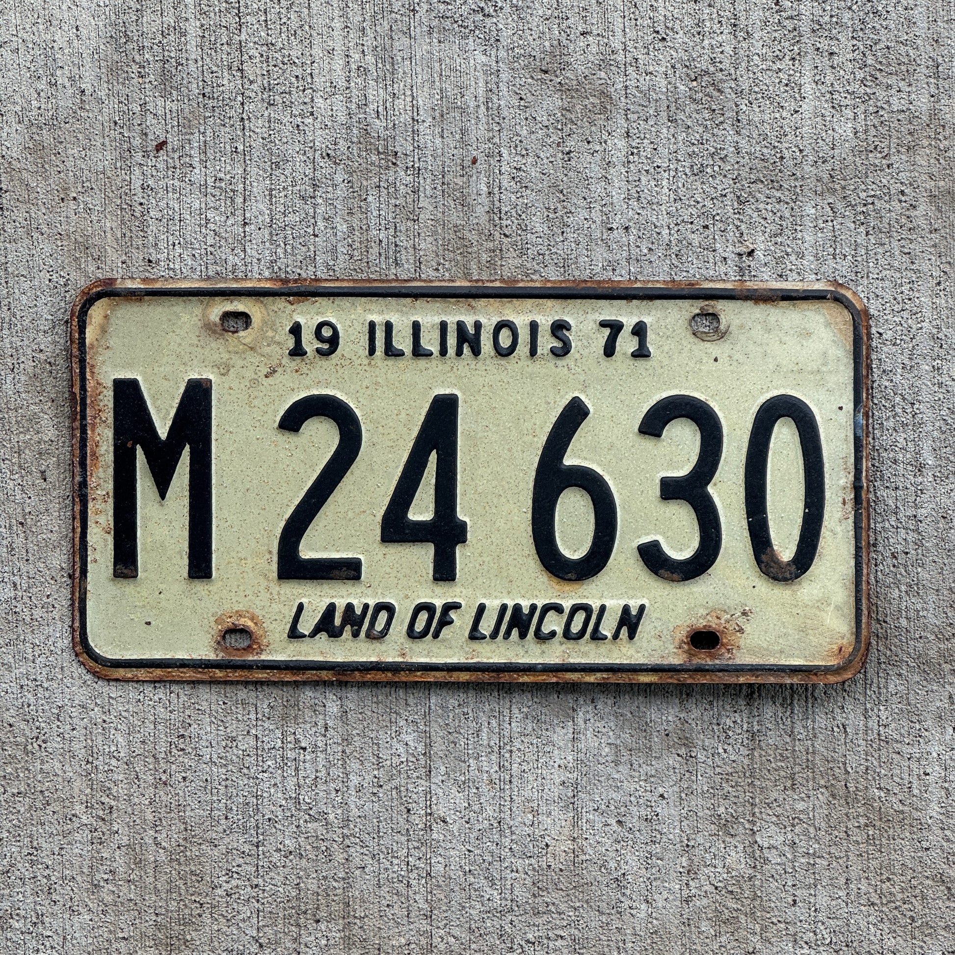 Photo of a 1971 Illinois Municipal License Plate Auto Tag 2 Vintage Garage M 24 630 with original patina