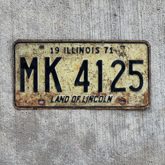 Photo of a 1971 Illinois Truck Mileage Tax License Plate Auto Tag Garage Decor Vintage MK 4125 with original patina