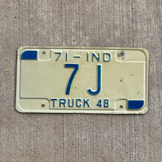 Photo of a 1971 Indiana Truck License Plate Auto Tag Garage Decor Vintage Low Number 7 J with original patina