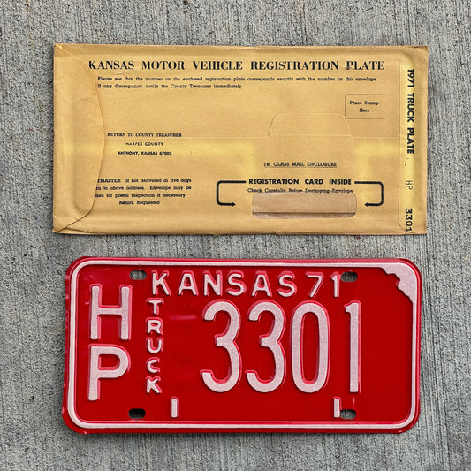 Photo of a 1971 Kansas Truck License Plate Auto Tag Garage Decor Vintage New Old Stock With Envelope HP 3301 with original patina