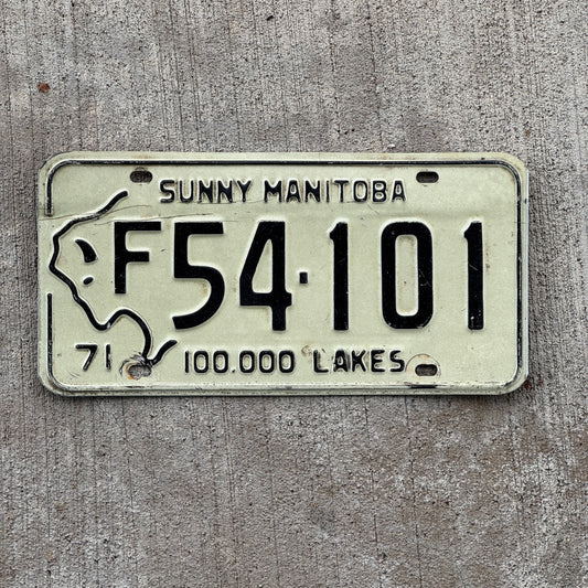 Photo of a 1971 Manitoba Farm Truck License Plate Auto Tag Garage Decor Vintage Buffalo Bison F 54 101 with original patina
