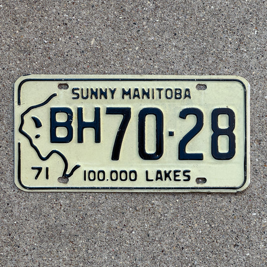 Photo of a 1971 Manitoba License Plate Auto Tag Garage Decor Vintage Bison Graphic BH 70 28 with original patina