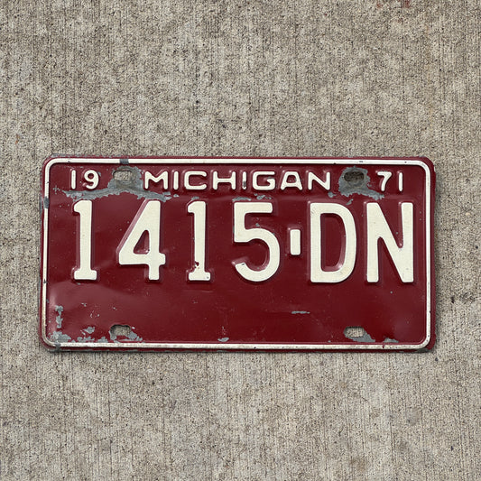Photo of a 1971 Michigan Commercial License Plate Auto Tag Garage Decor Vintage 1415 DN with original patina