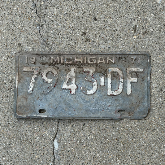 Photo of a 1971 Michigan Commercial License Plate Auto Tag Garage Decor Vintage 7943 DF with original patina