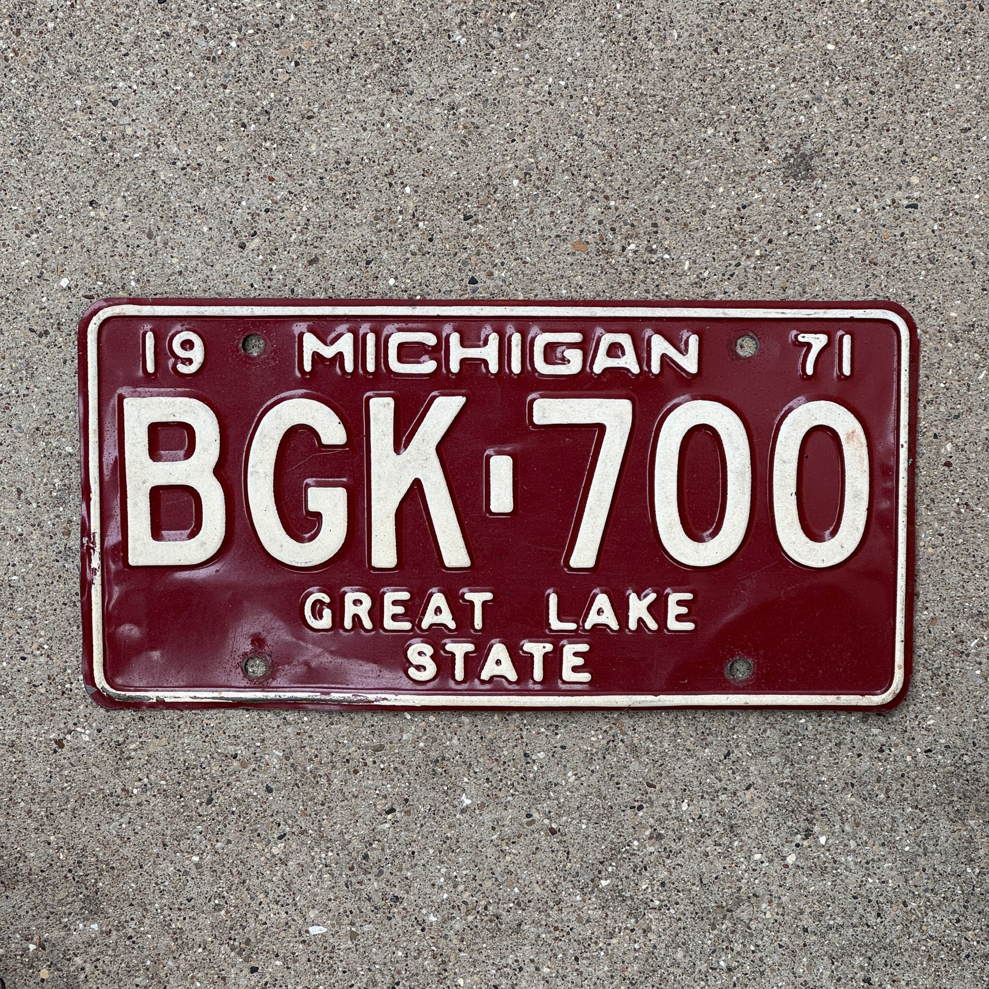 Photo of a 1971 Michigan License Plate Auto Tag Garage Decor Vintage Red White BGK 700