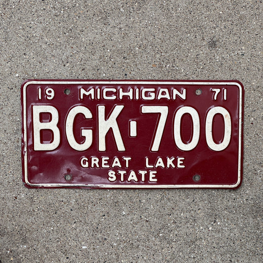 Photo of a 1971 Michigan License Plate Auto Tag Garage Decor Vintage Red White BGK 700