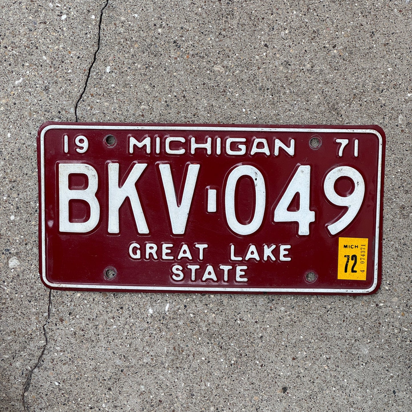 Photo of a 1971 Michigan License Plate Auto Tag Garage Decor Vintage Red White BKV 049