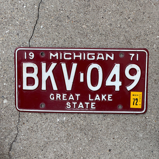 Photo of a 1971 Michigan License Plate Auto Tag Garage Decor Vintage Red White BKV 049