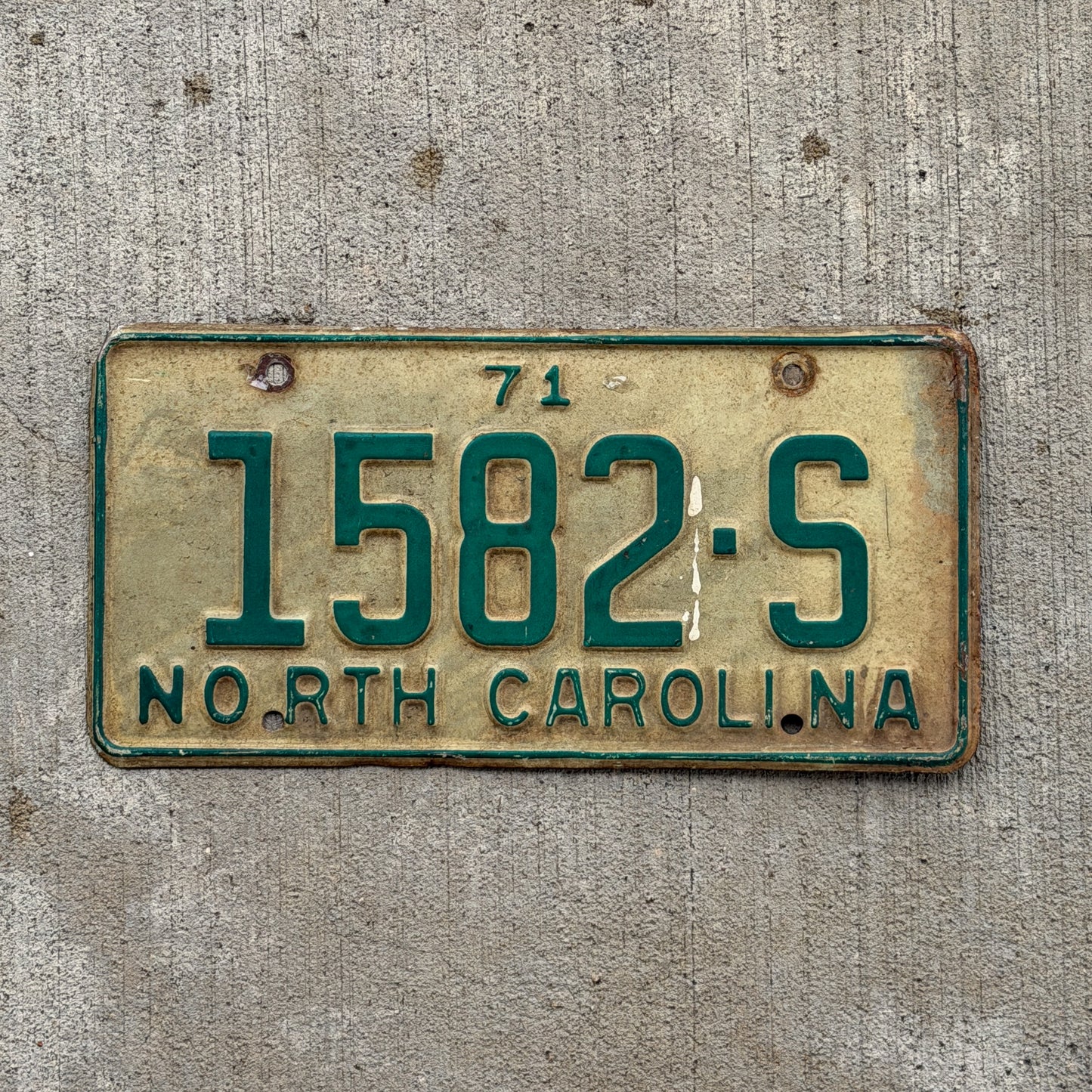 Photo of a 1971 North Carolina Truck License Plate Auto Tag Garage Decor Vintage 1582 S with original patina
