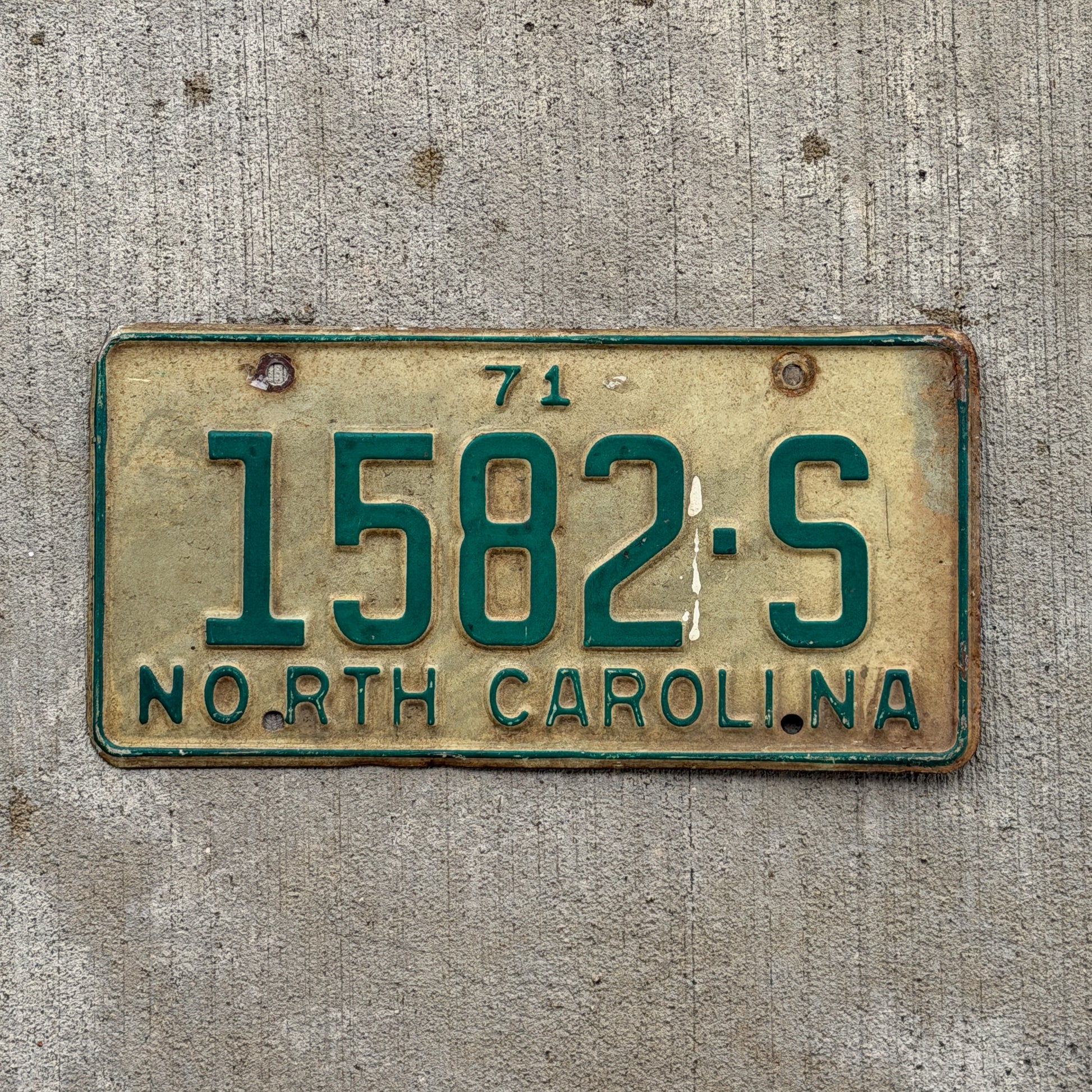 Photo of a 1971 North Carolina Truck License Plate Auto Tag Garage Decor Vintage 1582 S with original patina