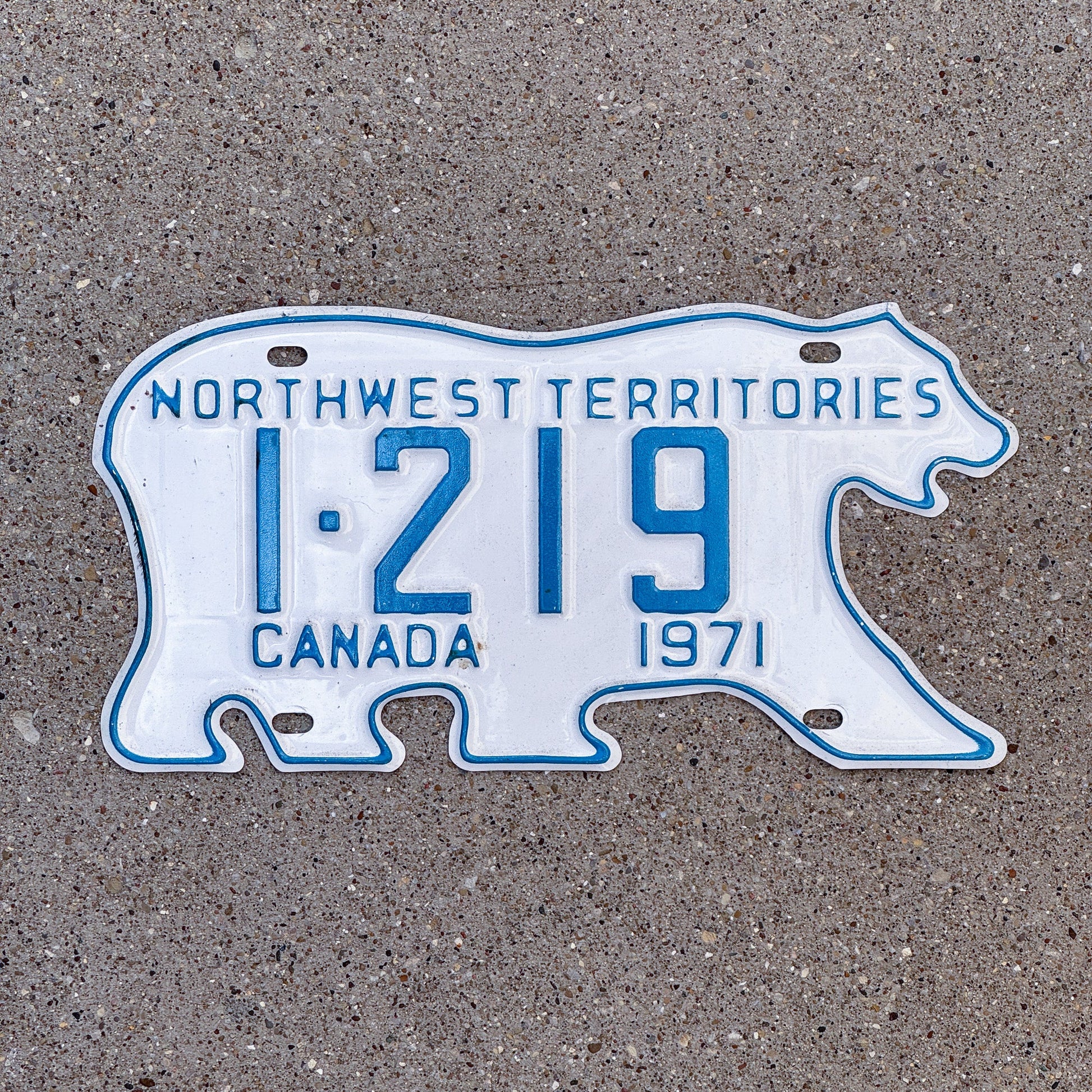 Photo of a 1971 Northwest Territories License Plate Auto Tag Garage Decor Vintage Low Number Four Digit Bear 1 219