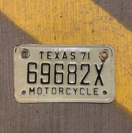 Photo of a 1971 Texas Motorcycle License Plate Auto Tag Garage Decor Vintage 69682 X with original patina