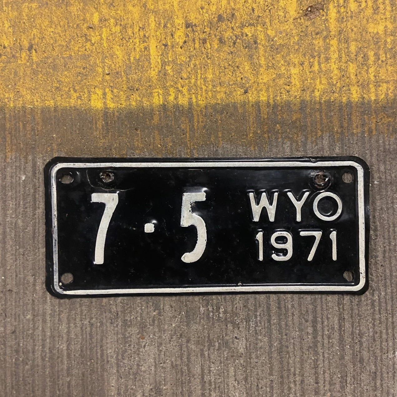 Photo of a 1971 Wyoming License Plate Auto Tag Garage Decor Vintage Goshen County 7 Low Number Single Digit 7 5 with original patina