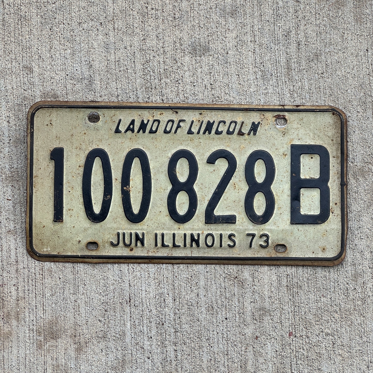 Photo of a 1972 1973 Illinois Truck License Plate Auto Tag Garage Decor Vintage 100 828 B with original patina