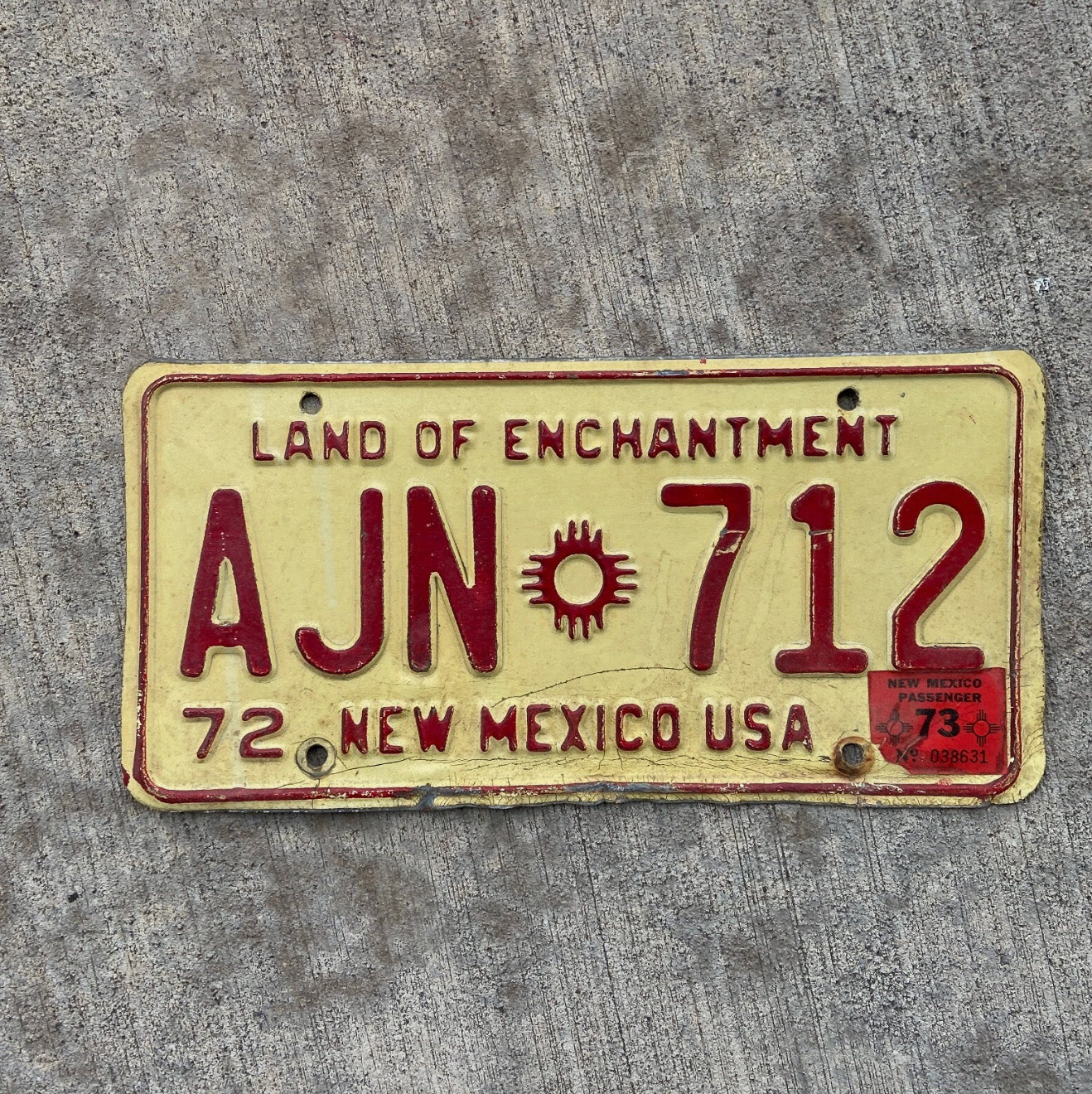 Photo of a 1972 1973 New Mexico License Plate Auto Tag Garage Decor Vintage AJN 712 with original patina