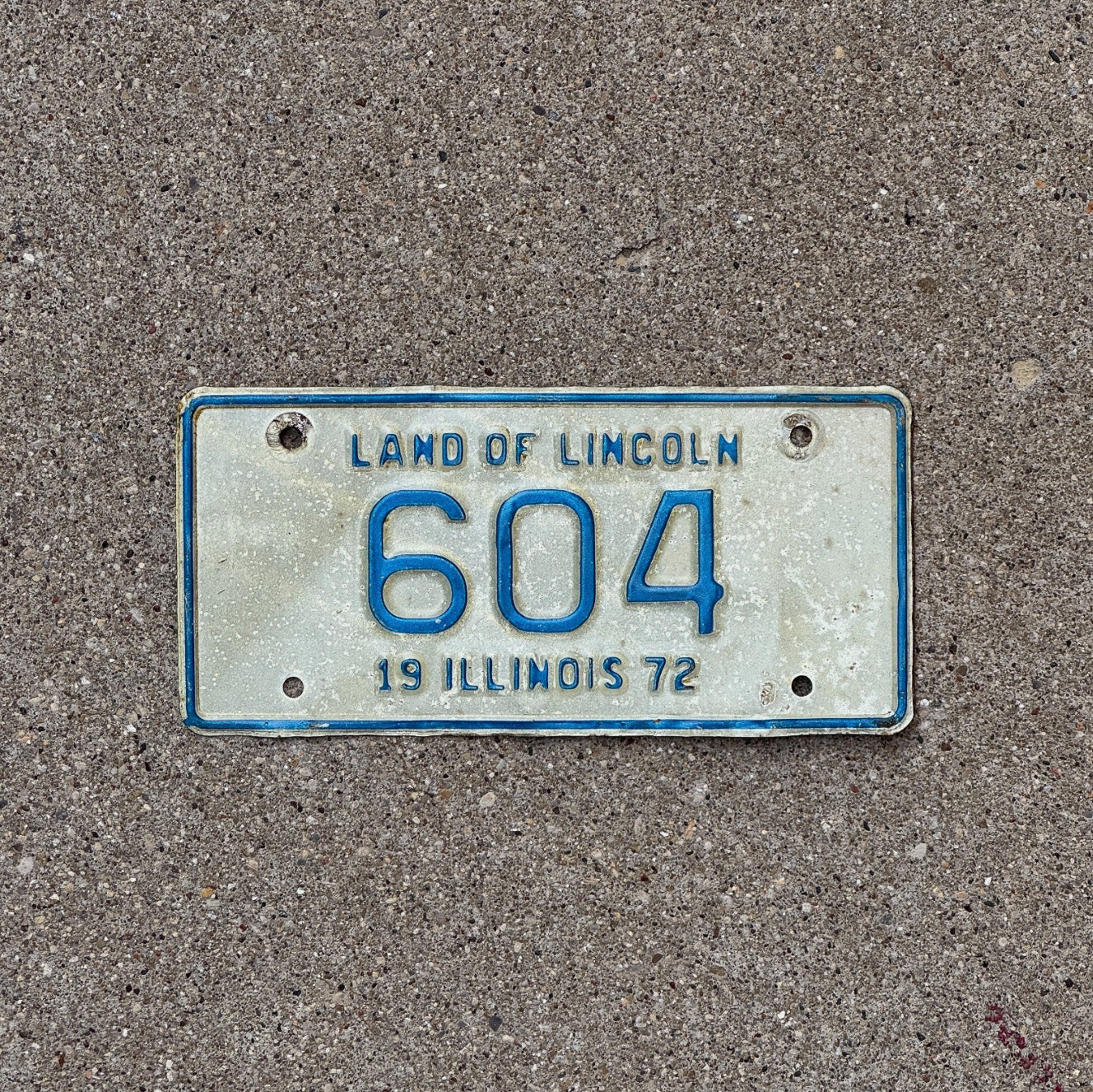 Photo of a 1972 Illinois Motorcycle License Plate Auto Tag Garage Decor Vintage Low Number Three Digit 604 with original patina