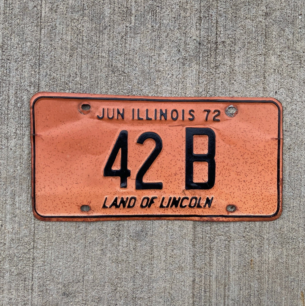 Photo of a 1972 Illinois Truck License Plate Auto Tag Garage Decor Vintage Low Number Two Digit 42 B with original patina