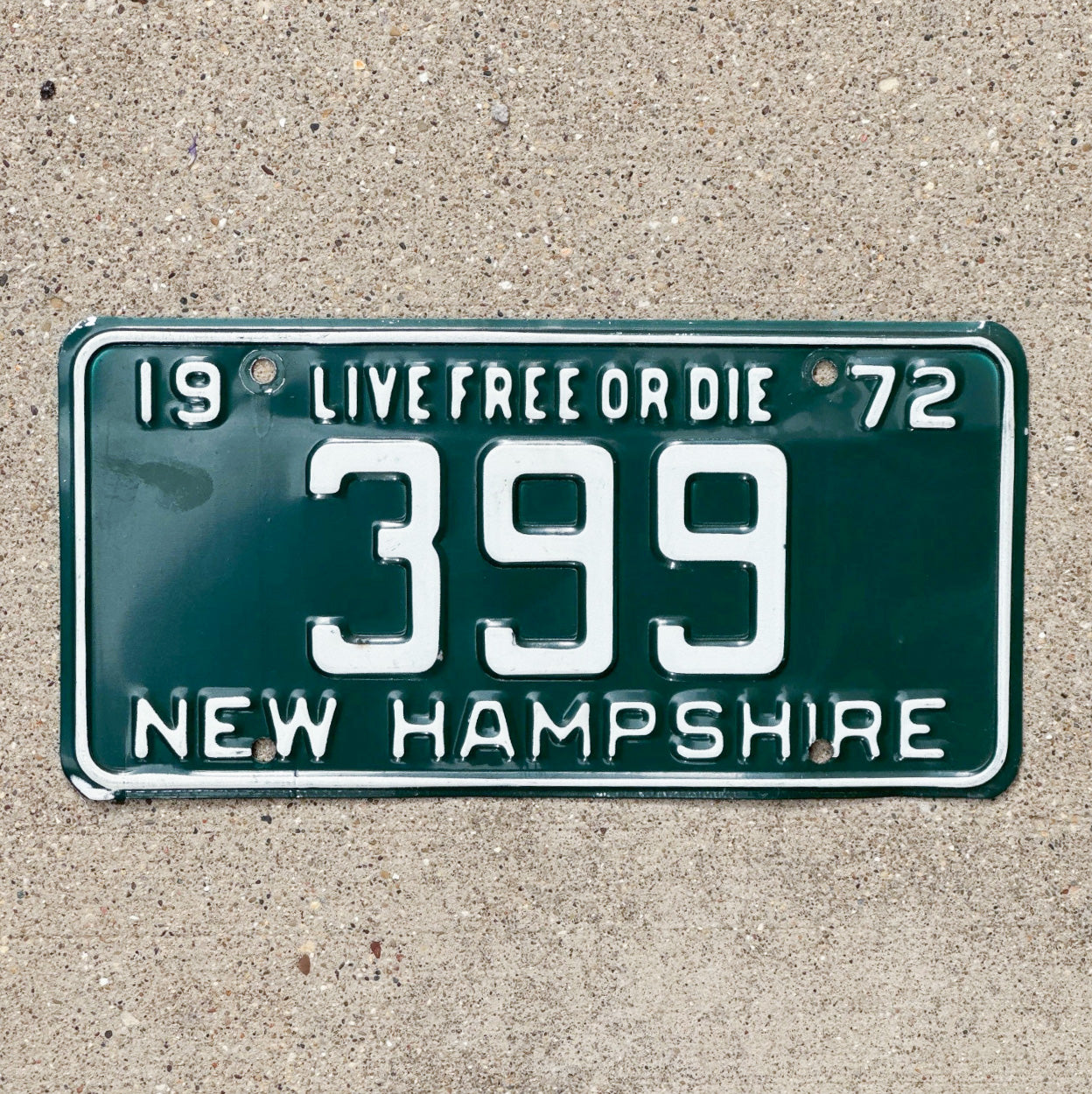 Photo of a 1972 New Hampshire License Plate Auto Tag 1 Vintage Garage Low Number Three Digit 399 with original patina
