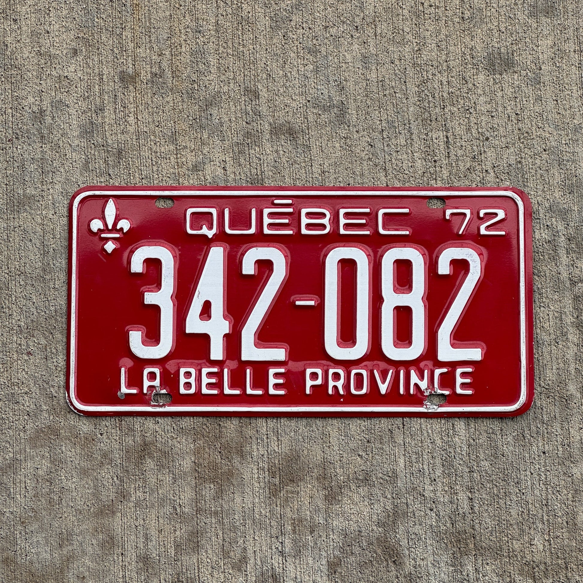 Photo of a 1972 Quebec License Plate Auto Tag Garage Decor Vintage 342 082 with original patina