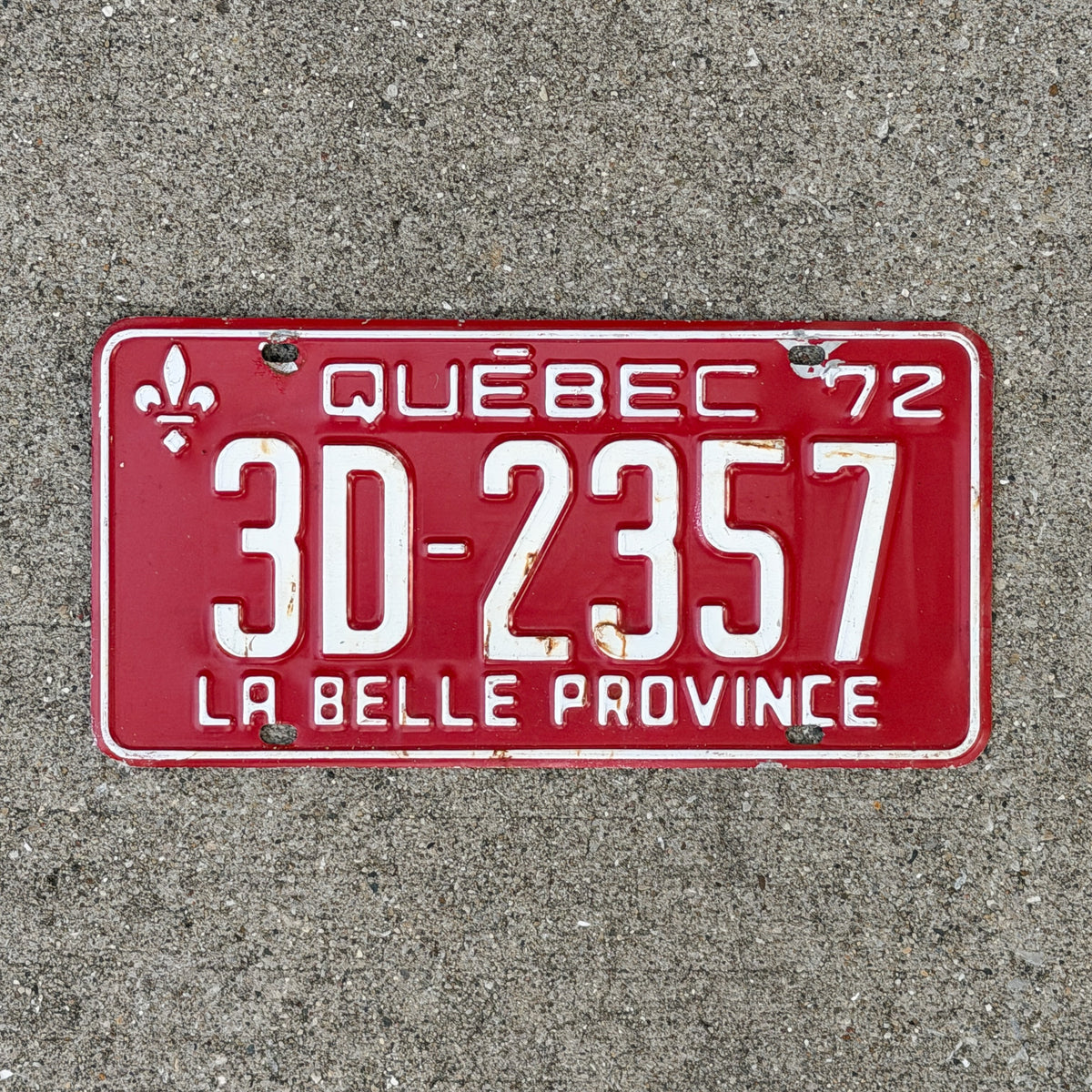 Photo of a 1972 Quebec License Plate Auto Tag Garage Decor Vintage 3D 2357 with original patina