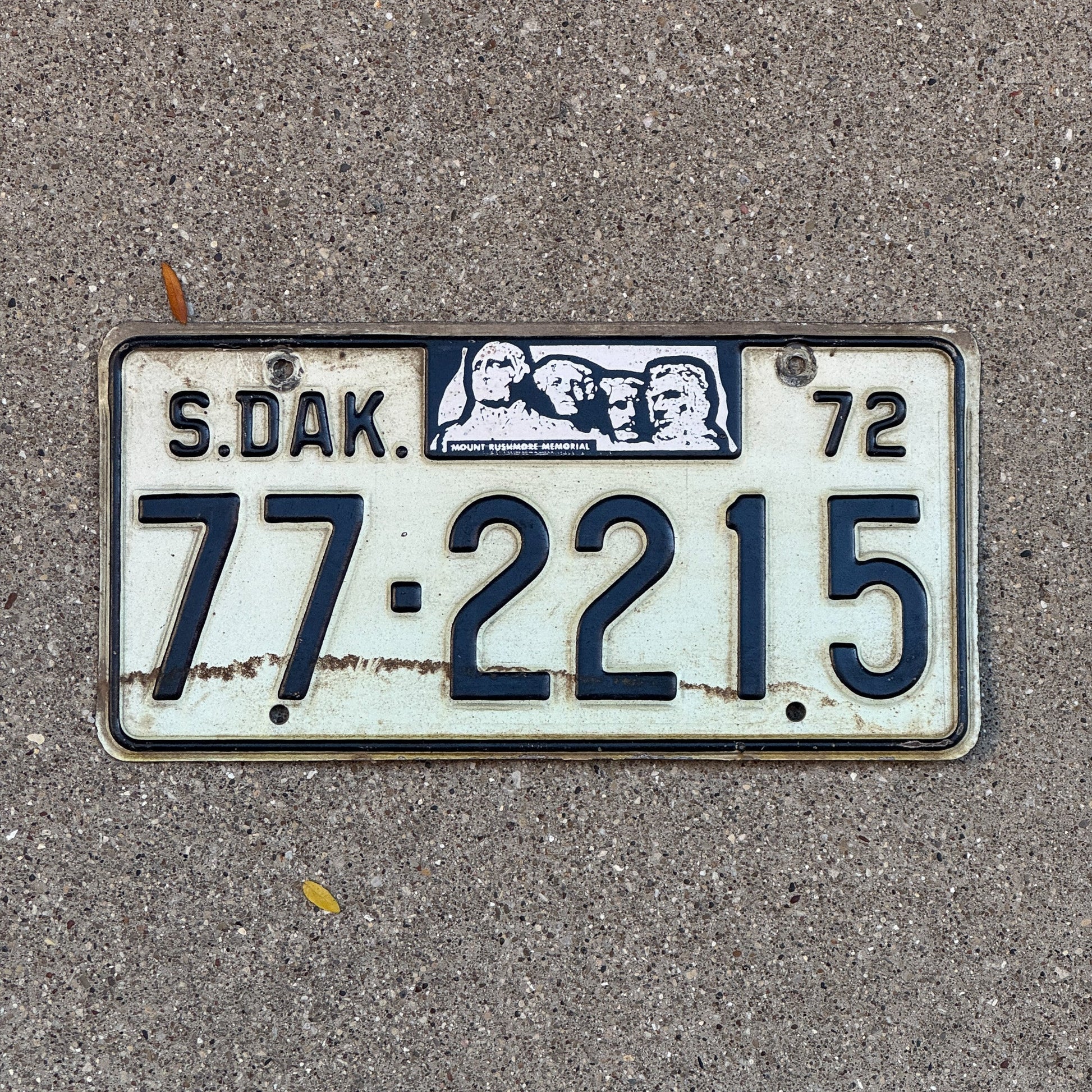 Photo of a 1972 South Dakota Dealer License Plate Auto Tag Garage Decor Vintage 77 2215 with original patina