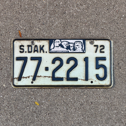 Photo of a 1972 South Dakota Dealer License Plate Auto Tag Garage Decor Vintage 77 2215 with original patina