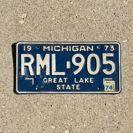 Photo of a 1973 1974 Michigan License Plate Auto Tag Garage Decor Vintage RML 905 with original patina
