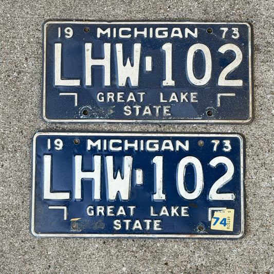 Photo of a 1973 1974 Michigan License Plate Pair Auto Tag Garage Decor Vintage LHW 102 with original patina