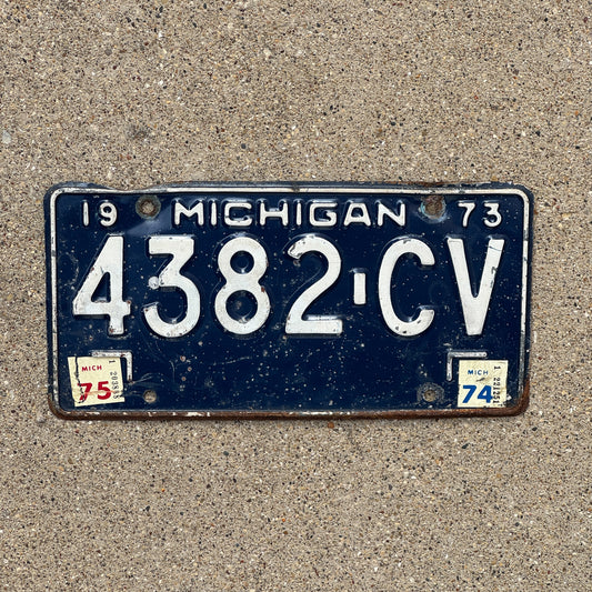 Photo of a 1973 1975 Michigan Commercial License Plate Auto Tag Garage Decor Vintage 4382 CV with original patina