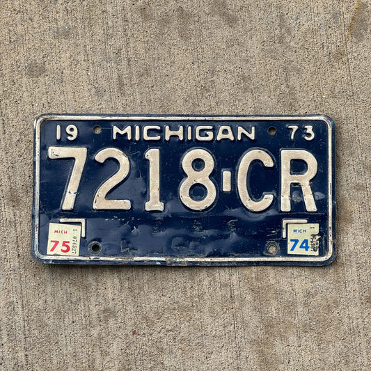 Photo of a 1973 1975 Michigan Commercial License Plate Auto Tag Garage Decor Vintage 7218 CR with original patina