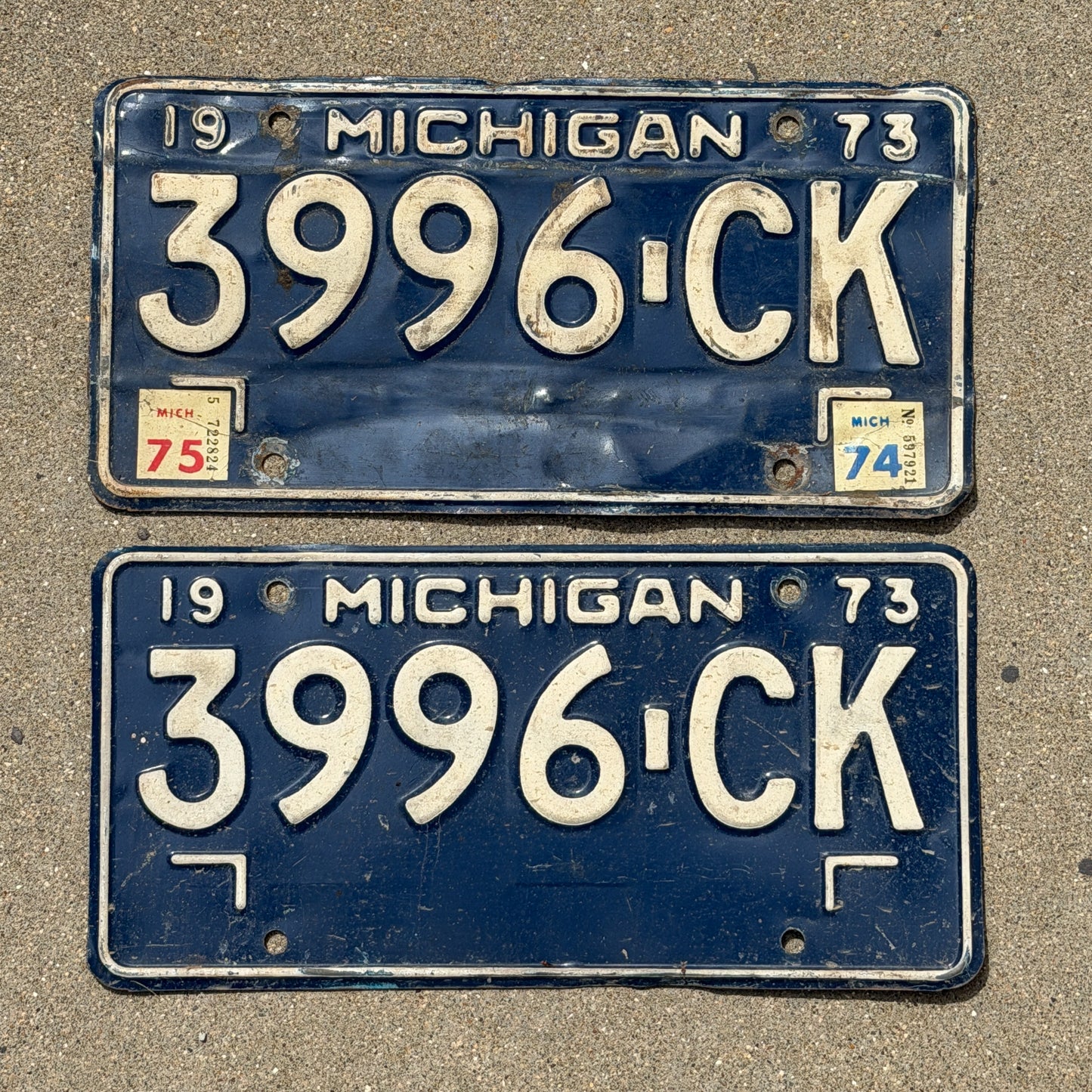 Photo of a 1973 1975 Michigan Commercial License Plate Pair Auto Tag Garage Decor Vintage 3996 CK with original patina