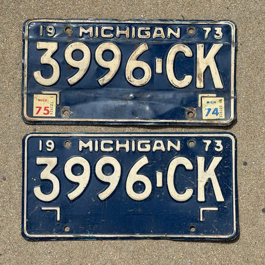 Photo of a 1973 1975 Michigan Commercial License Plate Pair Auto Tag Garage Decor Vintage 3996 CK with original patina