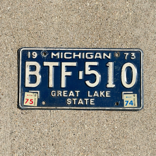 Photo of a 1973 1975 Michigan License Plate Auto Tag Garage Decor Vintage BTF 510 with original patina