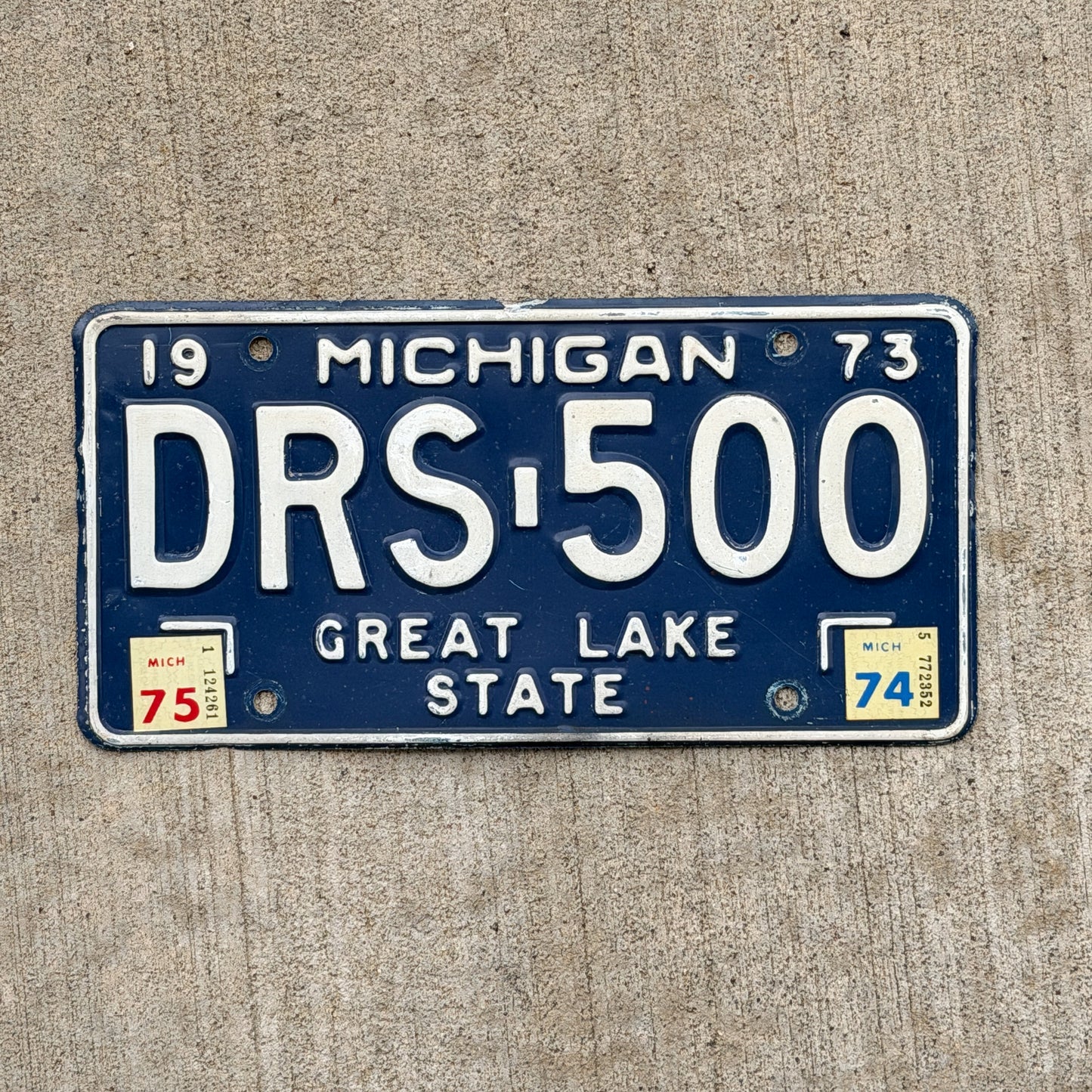 Photo of a 1973 1975 Michigan License Plate Auto Tag Garage Decor Vintage DRS 500 with original patina