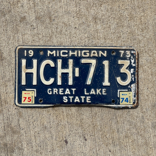 Photo of a 1973 1975 Michigan License Plate Auto Tag Garage Decor Vintage HCH 713 with original patina