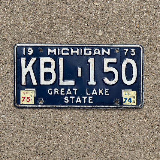 Photo of a 1973 1975 Michigan License Plate Auto Tag Garage Decor Vintage KBL 150 with original patina