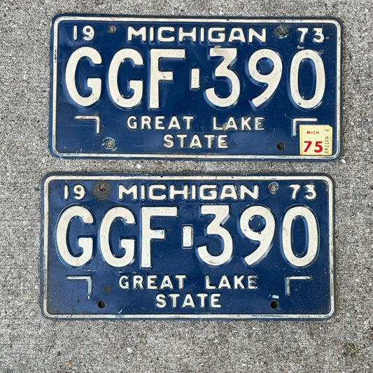 Photo of a 1973 1975 Michigan License Plate Pair Auto Tag Garage Decor Vintage GGF 390 with original patina